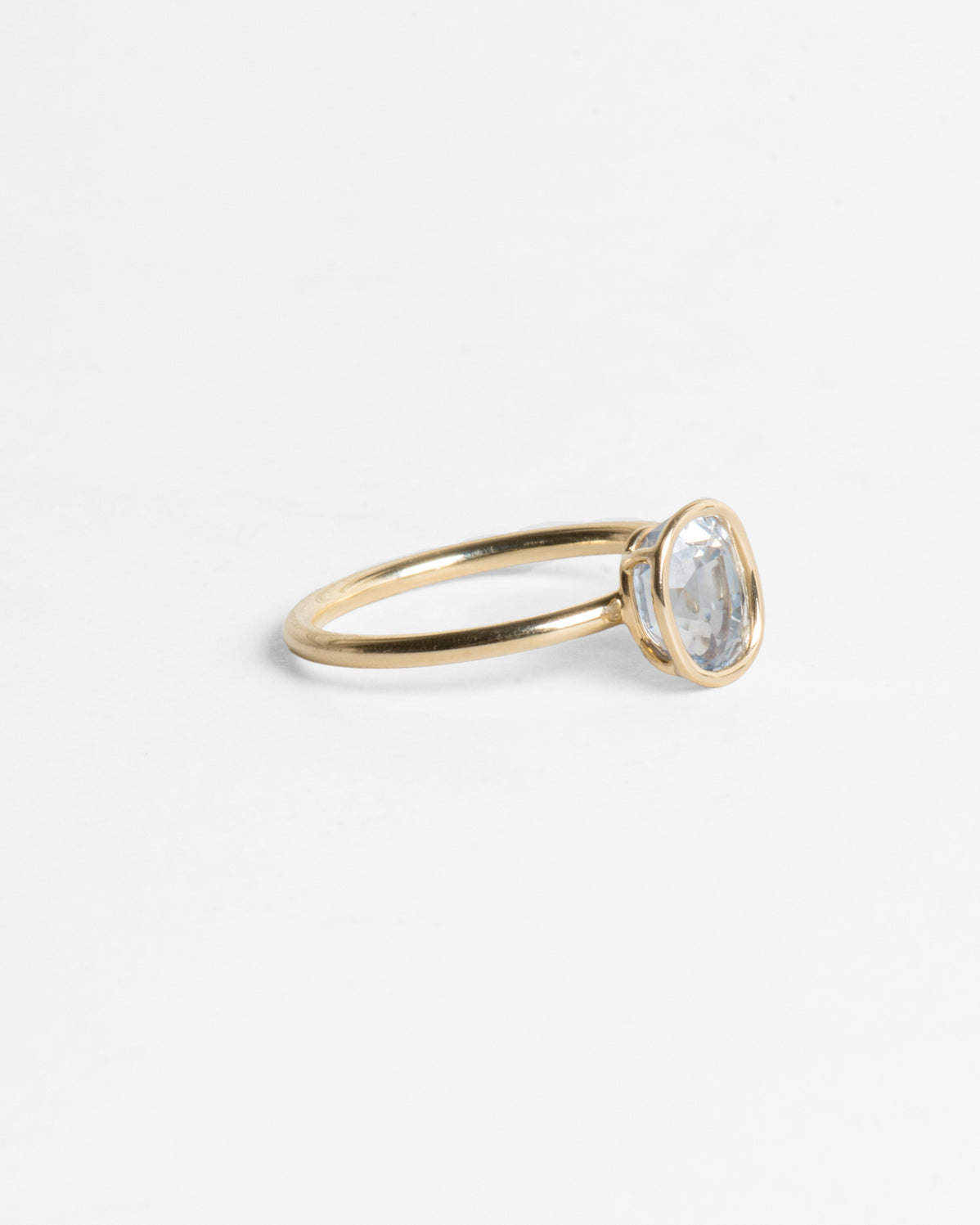 Pale Oval Sapphire Floating Ring in 14K Gold