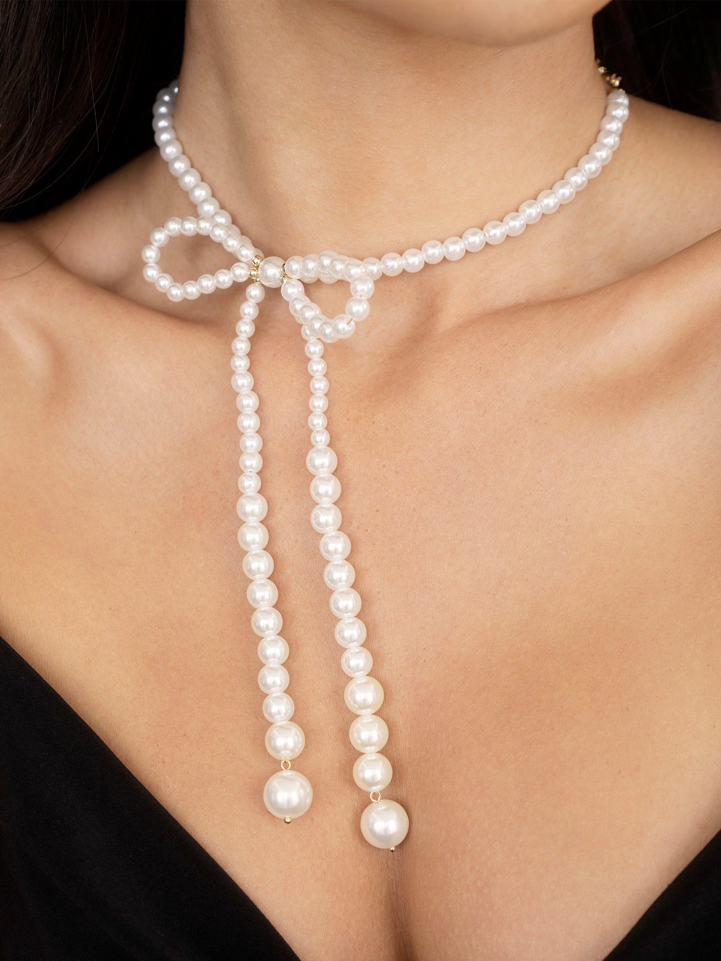 Elegant Pearl Bow Necklace in Silver