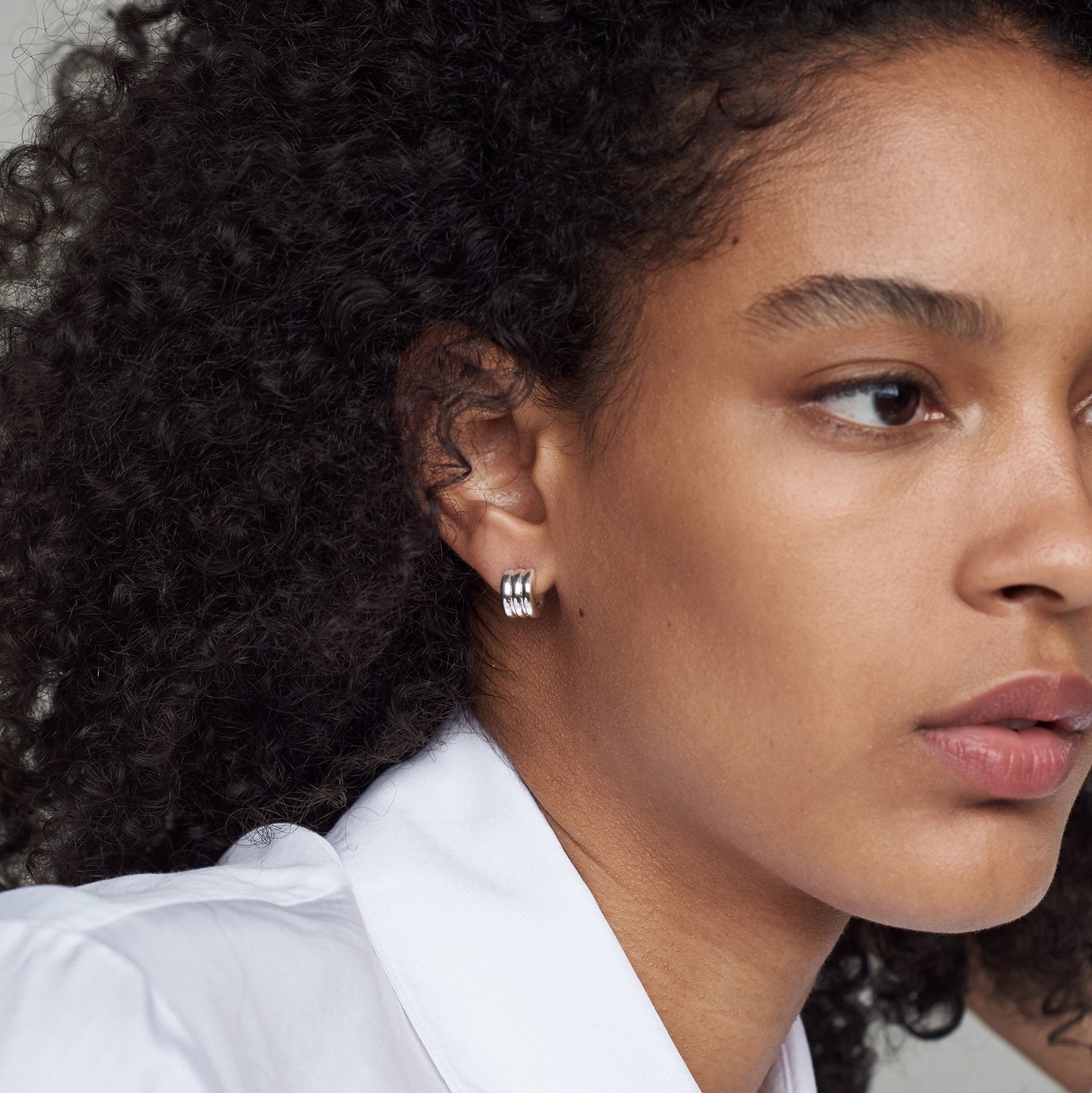 Triple Ridge Mini Hoop Earrings in Silver