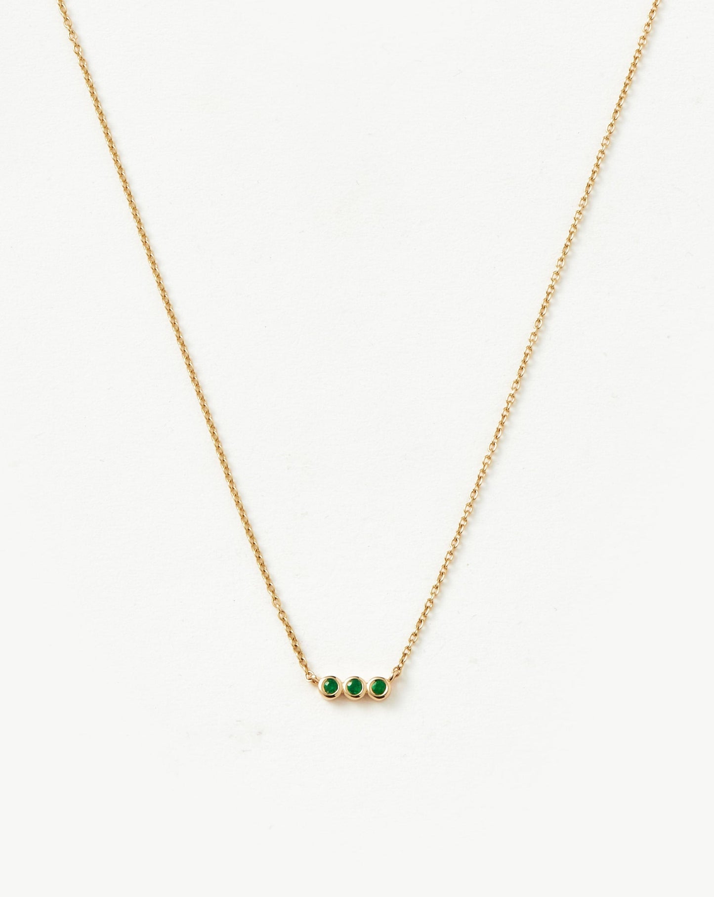 Emerald Solitaire Trio Necklace in Fine Design